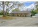 Charming single-story home featuring a covered front porch with outdoor seating at 5410 Deleon Springs Ranch Rd, De Leon Springs, FL 32130