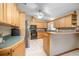 Well-equipped kitchen featuring wooden cabinets and modern appliances at 5410 Deleon Springs Ranch Rd, De Leon Springs, FL 32130