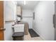 Functional laundry room with a sink, washing machine, dryer, and ample storage space at 5410 Deleon Springs Ranch Rd, De Leon Springs, FL 32130