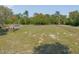 Green grassy acreage with partially fenced yard at 5410 Deleon Springs Ranch Rd, De Leon Springs, FL 32130