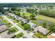 Community aerial view with lush green golf course, tranquil ponds and beautiful single-Gathering homes at 5479 Saint Regis Way, Port Orange, FL 32128