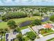 Golf course community aerial view showcasing tranquil lakes and single-Gathering homes from above at 5479 Saint Regis Way, Port Orange, FL 32128
