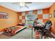 Unique bedroom with bright orange and white walls, drop ceiling, and a great view at 5479 Saint Regis Way, Port Orange, FL 32128