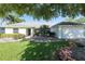 Charming single-story home with a two-car garage, lovely landscaping and mature landscaping at 5479 Saint Regis Way, Port Orange, FL 32128