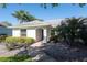 Inviting single-story home with well-maintained landscaping and a covered entryway, enhancing curb appeal at 5479 Saint Regis Way, Port Orange, FL 32128