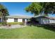 Charming single-story home with a well-manicured lawn and inviting curb appeal at 5479 Saint Regis Way, Port Orange, FL 32128