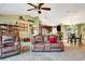 Spacious living room with vaulted ceilings featuring a view of the kitchen and dining room at 5479 Saint Regis Way, Port Orange, FL 32128