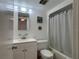 Bright bathroom featuring a bathtub with shower, a toilet, and a vanity with sink at 5500 Ocean Shore Blvd # Ut18, Ormond Beach, FL 32176