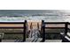 A boardwalk with stairs leads to a beautiful sandy beach and ocean, promoting easy access for residents at 5500 Ocean Shore Blvd # Ut18, Ormond Beach, FL 32176