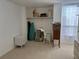 Bedroom with closet with shelving, filled with items; good natural light from the window at 5500 Ocean Shore Blvd # Ut18, Ormond Beach, FL 32176