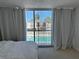 Bedroom with view of the swimming pool from sliding glass door at 5500 Ocean Shore Blvd # Ut18, Ormond Beach, FL 32176