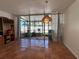 Bright sunroom with tile floors and large sliding glass doors leading to a fenced community pool, perfect for relaxation at 5500 Ocean Shore Blvd # Ut18, Ormond Beach, FL 32176
