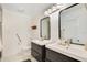 Modern bathroom with dual sinks, large mirrors, and contemporary fixtures in a neutral color palette at 563 Belltower Ave # 240, Deltona, FL 32725