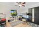 A bedroom featuring a bunk bed, large window, playful rugs, and storage shelves at 563 Belltower Ave # 240, Deltona, FL 32725