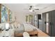 Inviting bedroom featuring hardwood floors, large sliding glass doors to a patio, and neutral decor with stylish furniture at 563 Belltower Ave # 240, Deltona, FL 32725