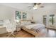 Bright bedroom with a ceiling fan, and a desk, offering comfort and functionality at 563 Belltower Ave # 240, Deltona, FL 32725