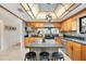 Bright kitchen featuring a mosaic backsplash, stainless steel appliances and an eat-in island at 563 Belltower Ave # 240, Deltona, FL 32725