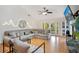 Bright and airy living room featuring comfortable seating, hardwood floors, and access to the outdoors at 563 Belltower Ave # 240, Deltona, FL 32725