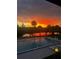 Enjoy the sunset view overlooking the pool and reflecting on the water at 563 Belltower Ave # 240, Deltona, FL 32725
