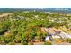 Aerial shot showcasing a wooded parcel of land near an urban area and water, perfect for development at 607 Herbert St, Port Orange, FL 32129