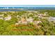 Aerial view featuring a parcel of land surrounded by lush trees, near urban areas and waterways at 607 Herbert St, Port Orange, FL 32129