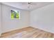 Empty bedroom featuring hardwood floors, white walls, and ample natural light at 607 Herbert St, Port Orange, FL 32129