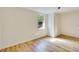 Cozy bedroom with hardwood floors, natural light, and closet at 607 Herbert St, Port Orange, FL 32129