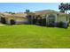 Charming single-story home with well-manicured lawn and lovely landscaping with a 2-car garage at 6182 Knotty Pine Ct, Port Orange, FL 32127