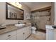 Bathroom featuring a single sink vanity, granite countertops, and a glass enclosed shower at 6194 Half Moon Dr, Port Orange, FL 32127