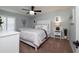 Cozy bedroom featuring carpet, a ceiling fan, a bed, and a side table with a lamp at 6194 Half Moon Dr, Port Orange, FL 32127