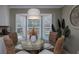 Eat-in kitchen area with a large bay window with view to the exterior pool at 6194 Half Moon Dr, Port Orange, FL 32127