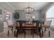 Elegant dining room featuring modern lighting, neutral paint and plenty of light at 6194 Half Moon Dr, Port Orange, FL 32127
