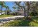 Beautiful home featuring a brick driveway, mature trees, and well-maintained landscaping at 6194 Half Moon Dr, Port Orange, FL 32127