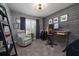 Office with a wooden desk, ergonomic chair, accent wall and natural light from the window at 6194 Half Moon Dr, Port Orange, FL 32127