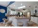 Eat-in kitchen featuring granite countertops, white cabinets, a breakfast bar and stainless steel appliances at 6194 Half Moon Dr, Port Orange, FL 32127