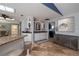 Eat-in kitchen area featuring granite countertops, white cabinets, stainless appliances and tiled floors at 6194 Half Moon Dr, Port Orange, FL 32127