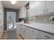 Laundry room featuring white cabinetry, an utility sink, and washer and dryer hookups at 6194 Half Moon Dr, Port Orange, FL 32127
