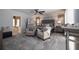 Main bedroom with sitting area, carpeted floors, a ceiling fan and an en-suite bathroom at 6194 Half Moon Dr, Port Orange, FL 32127