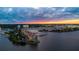 Picturesque sunset aerial view showcasing the waterfront condo complex, and marina at 761 Marina Point Dr # 7610, Daytona Beach, FL 32114