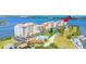 View of waterfront condos, community pool, and channel access at 761 Marina Point Dr # 7610, Daytona Beach, FL 32114