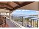 Charming outdoor balcony features a scenic water view, and wood ceiling at 761 Marina Point Dr # 7610, Daytona Beach, FL 32114