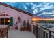 Balcony view showcasing a vibrant sunset over the marina and cityscape beyond at 761 Marina Point Dr # 7610, Daytona Beach, FL 32114