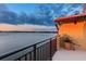 Balcony view showcasing a beautiful waterfront vista and colorful sunset skies at 761 Marina Point Dr # 7610, Daytona Beach, FL 32114