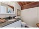Elegant bathroom with a white vanity, gray countertop, and a stylish mirror at 761 Marina Point Dr # 7610, Daytona Beach, FL 32114
