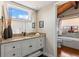 Bathroom featuring a vanity with drawers, a large mirror, and a walk-in shower at 761 Marina Point Dr # 7610, Daytona Beach, FL 32114