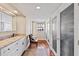 Bathroom with marble countertop vanity, hardwood floors, and views of the outdoor scenery at 761 Marina Point Dr # 7610, Daytona Beach, FL 32114