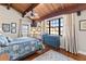 Cozy bedroom with a floral-patterned bedspread, a blue dresser, and lots of natural light at 761 Marina Point Dr # 7610, Daytona Beach, FL 32114