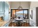 Cozy breakfast nook with water views, a chandelier, and seating for three at 761 Marina Point Dr # 7610, Daytona Beach, FL 32114