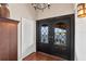 Grand entrance highlighting double doors with decorative ironwork and water views at 761 Marina Point Dr # 7610, Daytona Beach, FL 32114