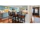 Open kitchen with blue cabinets, breakfast bar, stainless appliances, and direct access to the front door at 761 Marina Point Dr # 7610, Daytona Beach, FL 32114